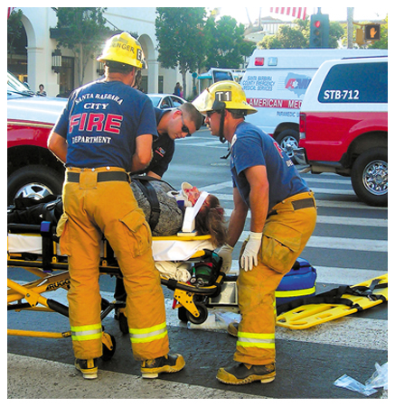 Emergency workers with an accident victim.